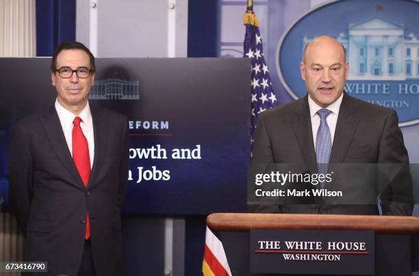 National Economic Director Gary Cohn , speaks while flanked by Secretary of the Treasury Steven Mnuchin during a briefing about President Trump's new...