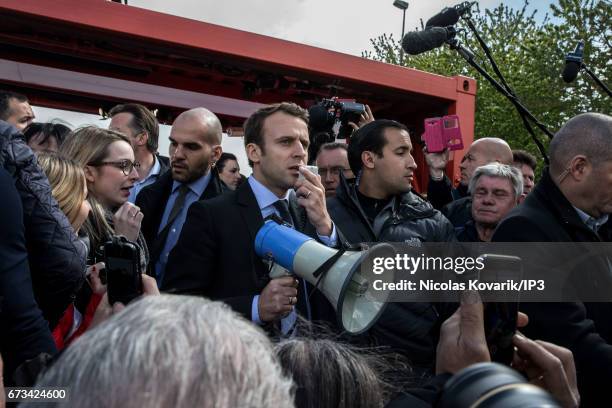 Founder and Leader of the political movement 'En Marche !' and presidential candidate Emmanuel Macron meets the employees of Whirlpool who whistle...