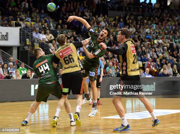 Kresimir Kozina, Sven-Soeren Christophersen, Petar Nenadic of Fuechse Berlin and Erik Schmidt of TSV Hannover Burgdorf during the game between...