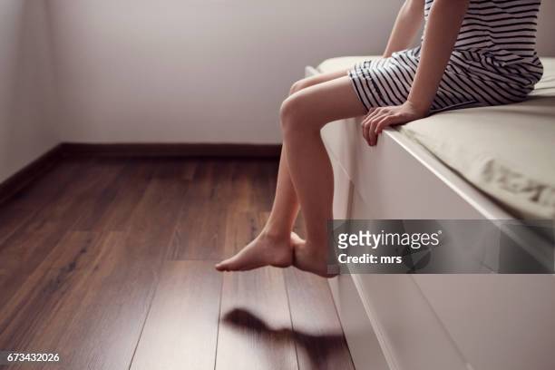 waking up - girl sitting on floor stock-fotos und bilder