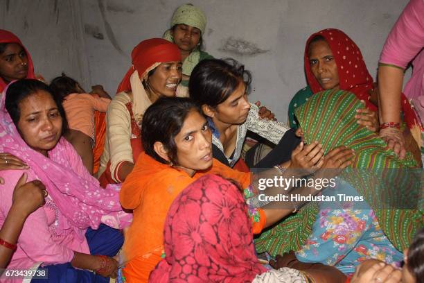 Family members of Sukma Martyr CRPF ASI Naresh Kumar mourning during the funeral at his native village Jainpur Tikola on April 26, 2017 in Sonepat,...