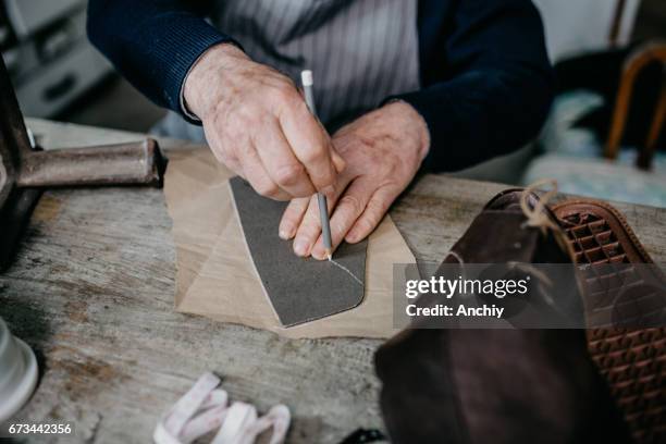 close up of a cobbler working at his shop - tailor stock pictures, royalty-free photos & images