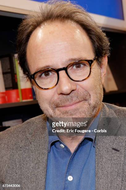 Writer Marc Levy poses during a portrait session in Paris, France on .
