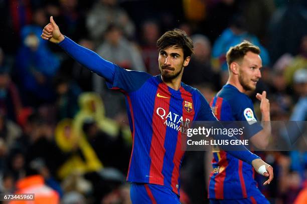 Barcelona's Portuguese midfielder Andre Gomes celebrates after scoring a goal during the Spanish league football match FC Barcelona vs CA Osasuna at...