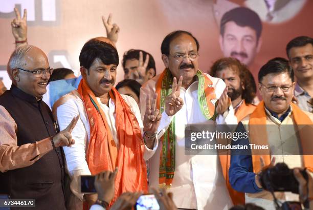 Union Minister M. Venkaiah Naidu with BJP Delhi Pradesh President Manoj Tiwari after MCD results during a press conference at party office on April...