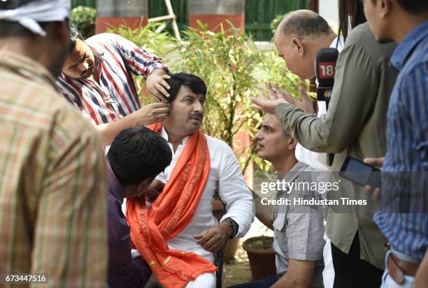 Delhi Pradesh President Manoj Tiwari after MCD results surrounded by media persons in queue for his interview at his residence South Avenue on April...