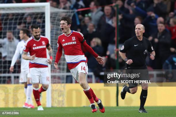 Middlesbrough's Dutch midfielder Marten de Roon celebrates after scoring the opening goal of the English Premier League football match between...