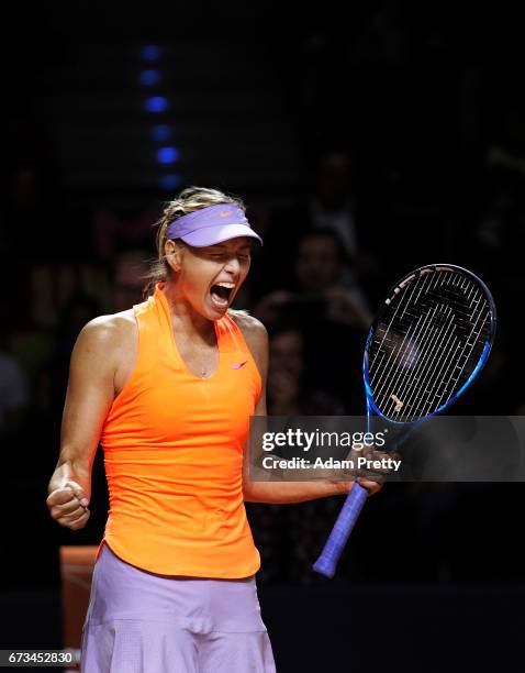 Maria Sharapova of Russia celebrates winning match point against Roberta Vinci of Italy during the Porsche Tennis Grand Prix at Porsche Arena on...