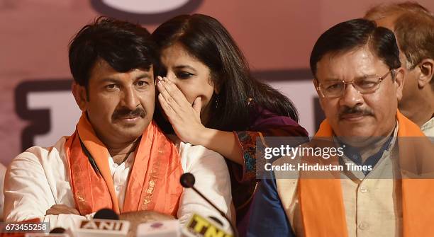 Leader Shazia Ilmi talking to Delhi BJP President Manoj Tiwari during a press conference at Delhi BJP Office after party's victory in MCD elections...