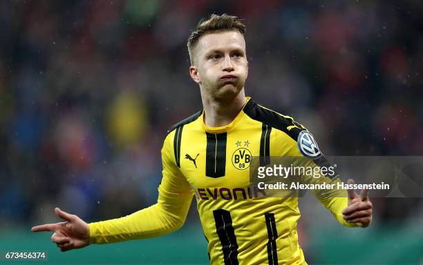Marco Reus of Dortmund celebrates after he scores the opening goal during the DFB Cup semi final match between FC Bayern Muenchen and Borussia...