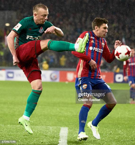 Kirill Nababkin of PFC CSKA Moscow challenged by Renat Yanbayev of FC Lokomotiv Moscow during the Russian Premier League match between PFC CSKA...