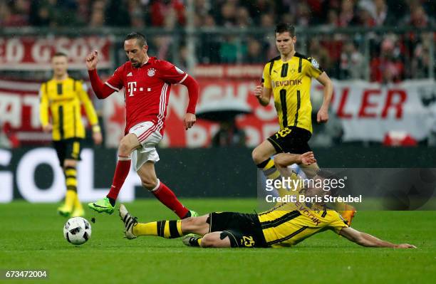 Franck Ribery of Muenchen and Sokratis of Dortmund battle for the ball during the DFB Cup semi final match between FC Bayern Muenchen and Borussia...