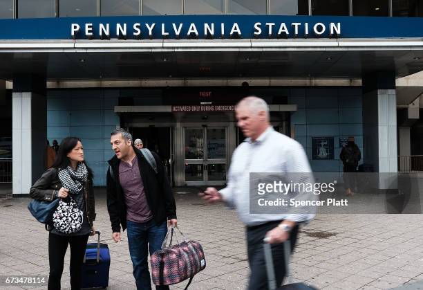 People walk past Pennsylvania Station on April 26, 2017 in New York City. Following two recent derailments at the crowded Manhattan station, Amtrak...