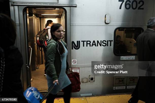 Passengers board a New Jersey Transit train at Pennsylvania Station on April 26, 2017 in New York City. Following two recent derailments at the...