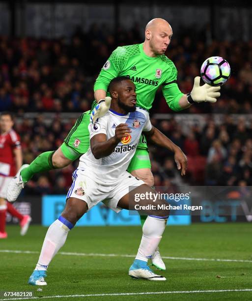 Brad Guzan of Middlesbrough and Victor Anichebe of Sunderland clash during the Premier League match between Middlesbrough and Sunderland at the...