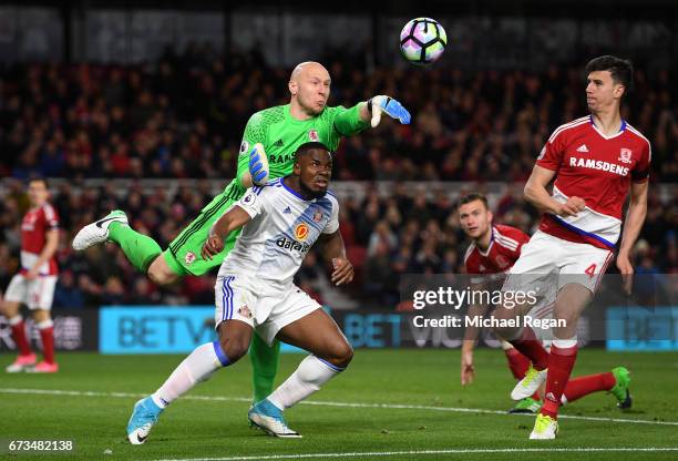 Brad Guzan of Middlesbrough and Victor Anichebe of Sunderland clash during the Premier League match between Middlesbrough and Sunderland at the...