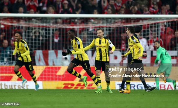 Ousmane Dembele of Dortmund celebrates after he scores the 3rd goal during the DFB Cup semi final match between FC Bayern Muenchen and Borussia...