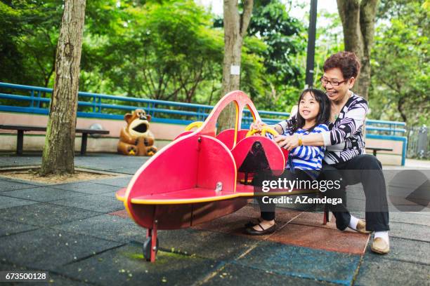 in playground - hong kong grandmother stock pictures, royalty-free photos & images