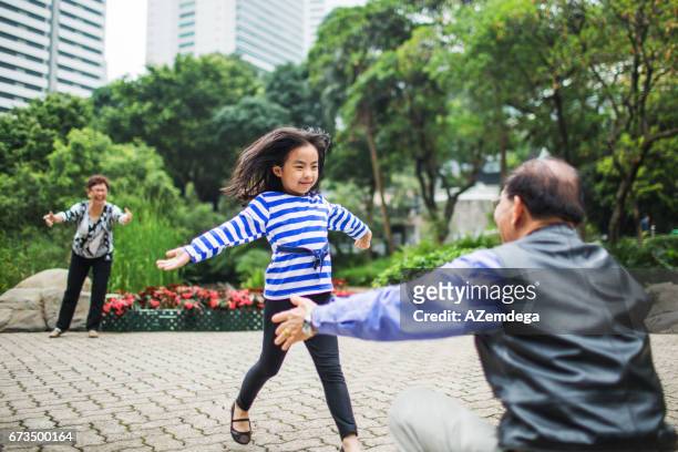 in park - hong kong grandmother stock pictures, royalty-free photos & images