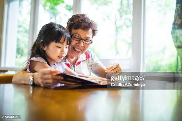 learning - hong kong grandmother stock pictures, royalty-free photos & images