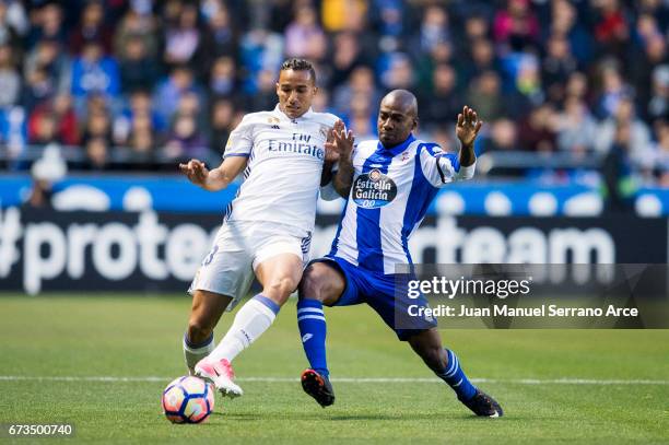 Danilo of Real Madrid duels for the ball with Gael Kakuta of RC Deportivo La Coruna during the La Liga match between RC Deportivo La Coruna and Real...