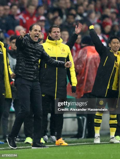 Thomas Tuchel, head coach of Dortmund celebrates victory after the DFB Cup semi final match between FC Bayern Muenchen and Borussia Dortmund at...