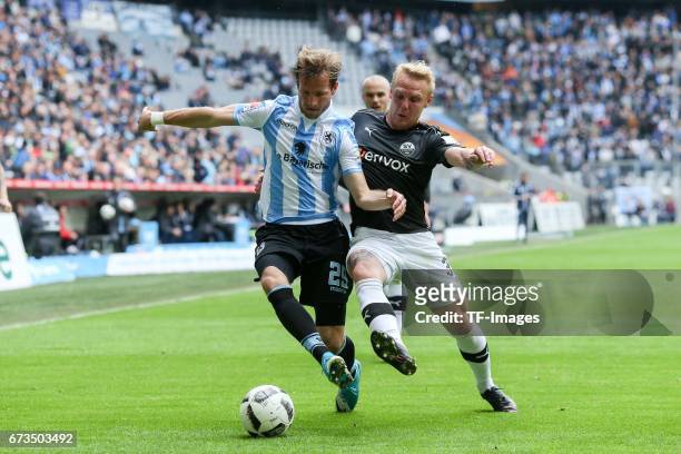 Stefan Aigner of 1860 Munich and Daniel Lukasik of Sandhausen battle for the ball during the Second Bundesliga match between TSV 1860 Muenchen and SV...