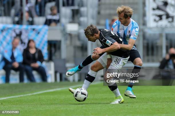 Stefan Aigner of 1860 Munich and Thomas Pledl of Sandhausen battle for the ball during the Second Bundesliga match between TSV 1860 Muenchen and SV...