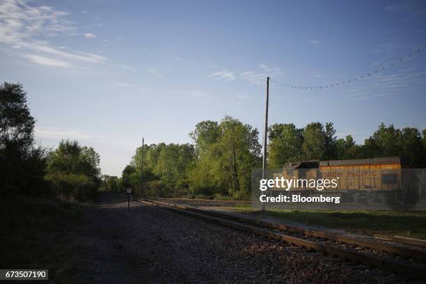 Union Pacific Corp. EMD GP38-2 freight locomotive waits for a clear signal before proceeding into a rail yard in East St. Louis, Illinois, U.S., on...