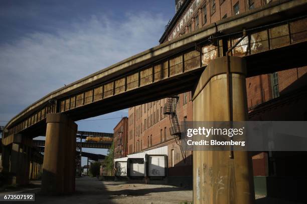 Union Pacific Corp. Freight locomotive accelerates up the West approach to the MacArthur Bridge while pulling a coal train East across the...