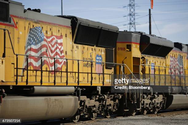 American flags are painted on the side of Union Pacific Corp. Freight locomotives in St. Louis, Missouri, U.S., on Tuesday, April. 25, 2017. Union...