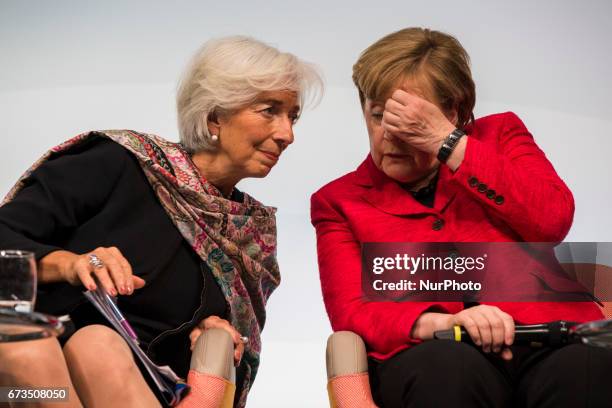 Managing Director of the International Monetary Fund Christine Lagarde and German Chancellor Angela Merkel are pictured during the Woman 20 Summit in...