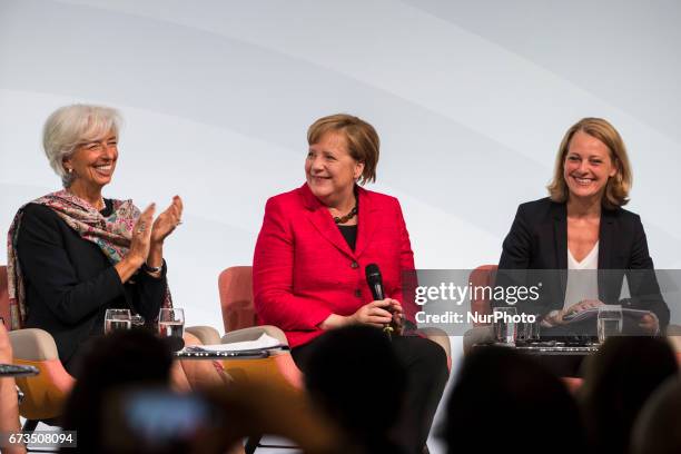 Managing Director of the International Monetary Fund Christine Lagarde and German Chancellor Angela Merkel are pictured during the Woman 20 Summit in...