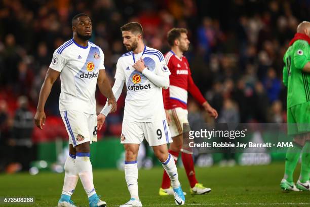 Victor Anichebe of Sunderland and Fabio Borini of Sunderland dejected at full time during the Premier League match between Middlesbrough and...