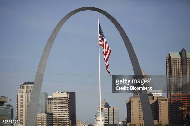 An American flag flies past the Gateway Arch in East St. Louis, Illinois, U.S., on Tuesday, April. 25, 2017. Union Pacific Corp. Is scheduled to...