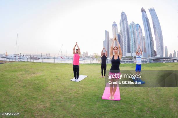 poise, balance and patience, yoga teaches these elements - yoga office arab stock pictures, royalty-free photos & images