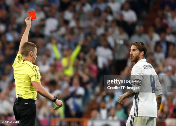 Referee Alejandro Hernandez Hernandez shows Sergio Ramos of Real Madrid the red card during the La Liga match between Real Madrid CF and FC Barcelona...