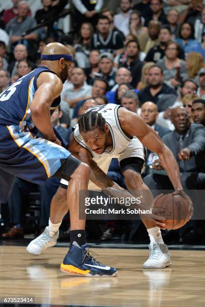 Kawhi Leonard of the San Antonio Spurs handles the ball against the Memphis Grizzlies during Game Five of the Western Conference Quarterfinals of the...