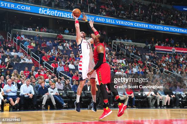 Marcin Gortat of the Washington Wizards shoots the ball during the game against the Atlanta Hawks in Game Five of the Eastern Conference...