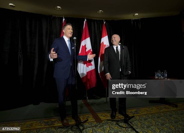 Maxime Bernier, Member of Parliament and Conservative Party leader candidate, left, speaks as Kevin O'Leary, chairman of O'Shares Exchange Traded...