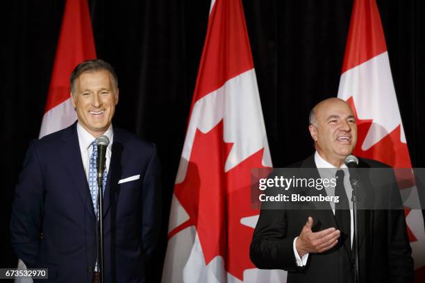 Maxime Bernier, Member of Parliament and Conservative Party leader candidate, left, smiles as Kevin O'Leary, chairman of O'Shares Exchange Traded...