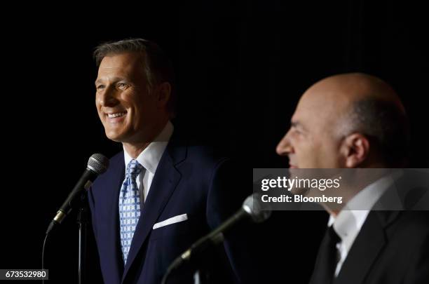 Maxime Bernier, Member of Parliament and Conservative Party leader candidate, left, smiles as Kevin O'Leary, chairman of O'Shares Exchange Traded...