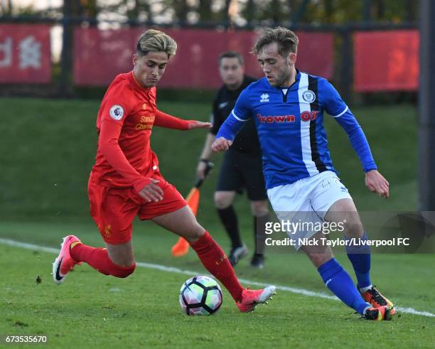 Yan Dhanda of Liverpool and Jack Stewart of Rochdale in action during the Liverpool v Rochdale Lancashire Senior Cup Semi-Final at The Kirkby Academy...