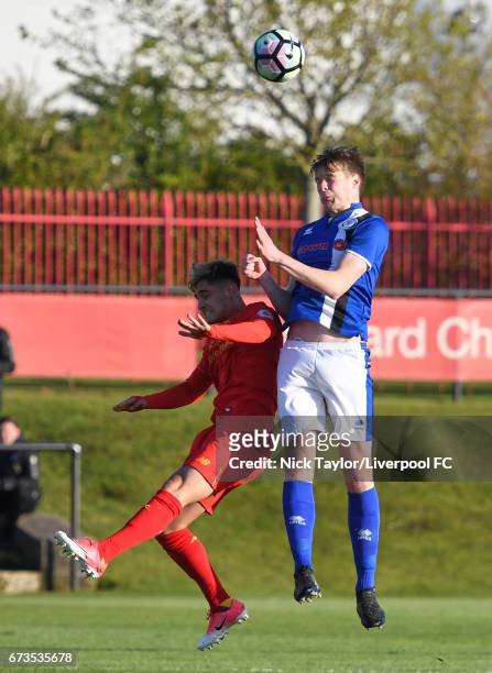 Yan Dhanda of Liverpool and Declan Evans of Rochdale in action during the Liverpool v Rochdale Lancashire Senior Cup Semi-Final at The Kirkby Academy...