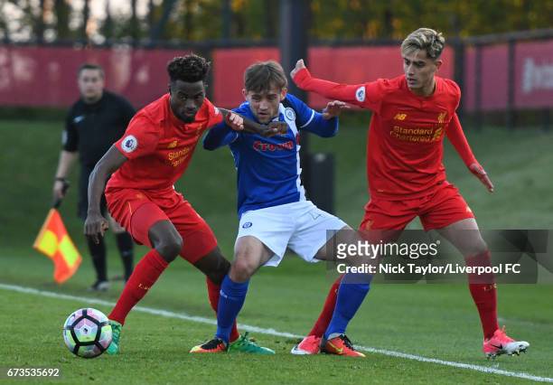 Madger Gomes and Yan Dhanda of Liverpool and Jack Stewart of Rochdale in action during the Liverpool v Rochdale Lancashire Senior Cup Semi-Final at...