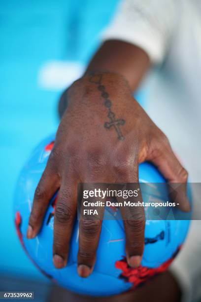 Detailed view of the tattoo on Premier League football player with Everton Football Club, Yannick Bolasie as he looks on during the Brazil training...