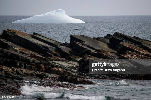 An iceberg floats in the water off the coast of Portugal Cove South, Newfoundland, Canada, April 26, 2017. Icebergs break off from Baffin Island and...