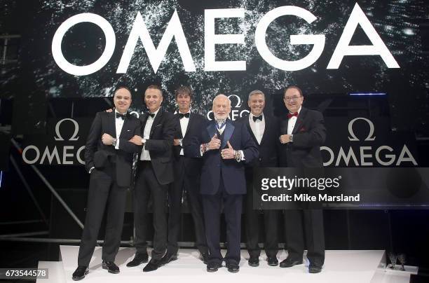 Petros Protopapas, Raynald Aeschlimann, Prof. Brian Cox, Buzz Aldrin, George Clooney and Jim Ragan on stage at the OMEGA 'Lost In Space' dinner to...