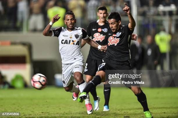 Otero of Atletico MG and Cardozo of Libertad battle for the ball during a match between Atletico MG and Libertad as part of Copa Bridgestone...