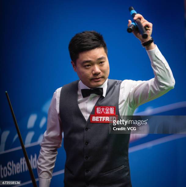 Ding Junhui of China reacts during his quarter final match against Ronnie O'Sullivan of England on day twelve of Betfred World Championship 2017 at...